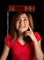 Free Stock Photo: A cute young girl balancing a book on her head
