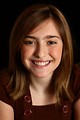 Free Stock Photo: Close-up portrait of a cute young girl posing before a black background
