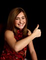 Free Stock Photo: A cute young girl making a thumbs up hand signal