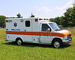 Free Stock Photo: An ambulance parked on the grass