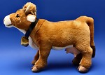 Free Stock Photo: A cow stuffed animal on a blue background
