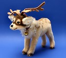 Free Stock Photo: A reindeer stuffed animal on a blue background