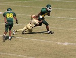 Free Stock Photo: A football player getting tackled