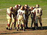 Free Stock Photo: Football players in a huddle on a field