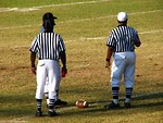 Free Stock Photo: Football referees standing on a field