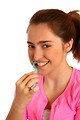 Free Stock Photo: A cute young girl brushing her teeth