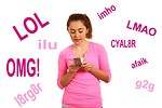 Free Stock Photo: A cute young girl texting on a cell phone