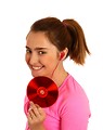 Free Stock Photo: A cute young girl listening to music and holding a cd