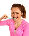 Free Stock Photo: A cute young girl brushing her teeth