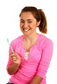 Free Stock Photo: A cute young girl holding a tooth brush