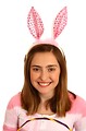 Free Stock Photo: A cute young girl dressed in a bunny costume holding an Easter basket