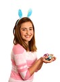 Free Stock Photo: A cute young girl dressed in bunny ears holding Easter eggs