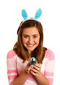 Free Stock Photo: A cute young girl dressed in bunny ears holding an Easter egg