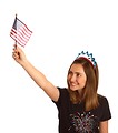 Free Stock Photo: A cute young girl dressed up for the 4th of July holding a small American flag