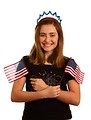 Free Stock Photo: A cute young girl dressed up for the 4th of July holding small American flags