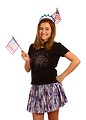 Free Stock Photo: A cute young girl dressed up for the 4th of July holding small American flags