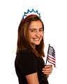 Free Stock Photo: A cute young girl dressed up for the 4th of July holding a small American flag