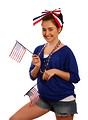Free Stock Photo: A cute young girl dressed up for the 4th of July holding small American flags