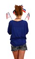 Free Stock Photo: A cute young girl dressed up for the 4th of July holding small American flags