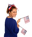 Free Stock Photo: A cute young girl dressed up for the 4th of July holding small American flags