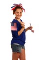 Free Stock Photo: A cute young girl dressed up for the 4th of July holding small American flags