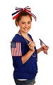 Free Stock Photo: A cute young girl dressed up for the 4th of July holding small American flags