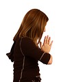 Free Stock Photo: A cute young girl praying with a white background