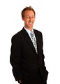 Free Stock Photo: A young businessman in a suit isolated on a white background