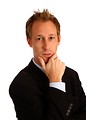 Free Stock Photo: A young businessman in a suit isolated on a white background