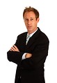 Free Stock Photo: A young businessman with crossed arms isolated on a white background