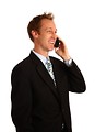 Free Stock Photo: A young businessman talking on a cell phone