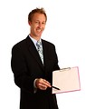 Free Stock Photo: A young businessman holding a clipboard and pen