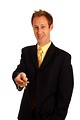 Free Stock Photo: A young businessman in a suit holding a key