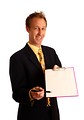 Free Stock Photo: A young businessman in a suit holding a clipboard and pen.