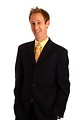 Free Stock Photo: A young businessman in a suit and tie isolated on a white background
