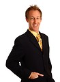 Free Stock Photo: A young businessman in a suit and tie isolated on a white background