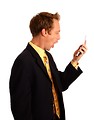 Free Stock Photo: A young businessman in a suit screaming at a cell phone