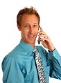 Free Stock Photo: A young businessman talking on a cell phone