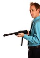 Free Stock Photo: A young businessman holding a rifle