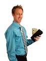 Free Stock Photo: A young businessman holding a wallet with money