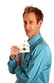 Free Stock Photo: A young businessman holding a pair of aces