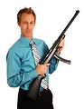 Free Stock Photo: A young businessman holding a rifle.