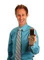 Free Stock Photo: A young businessman holding a cell phone