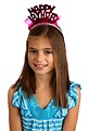 Free Stock Photo: A cute young girl posing with a happy birthday tiara