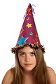 Free Stock Photo: A beautiful young girl wearing a large birthday hat