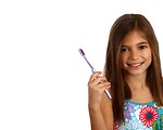 Free Stock Photo: A pretty young girl holding a toothbrush