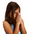 Free Stock Photo: A pretty young girl praying with a white background