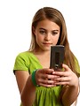 Free Stock Photo: A beautiful young girl texting on a cell phone