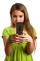Free Stock Photo: A beautiful young girl texting on a cell phone