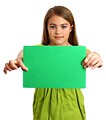 Free Stock Photo: A beautiful young girl holding a blank green sign